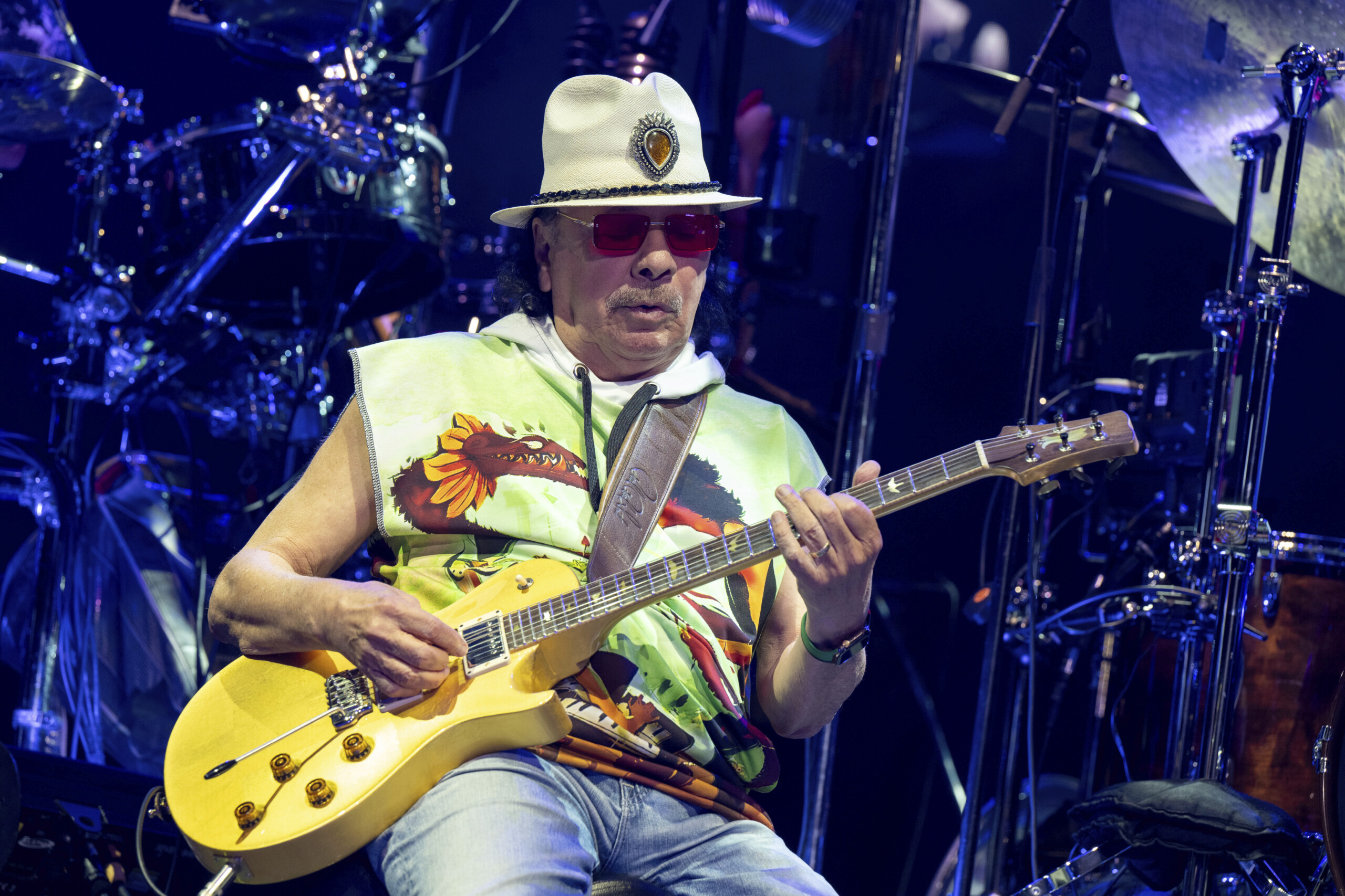 carlos santana in hospital postpones concert after illness scaled