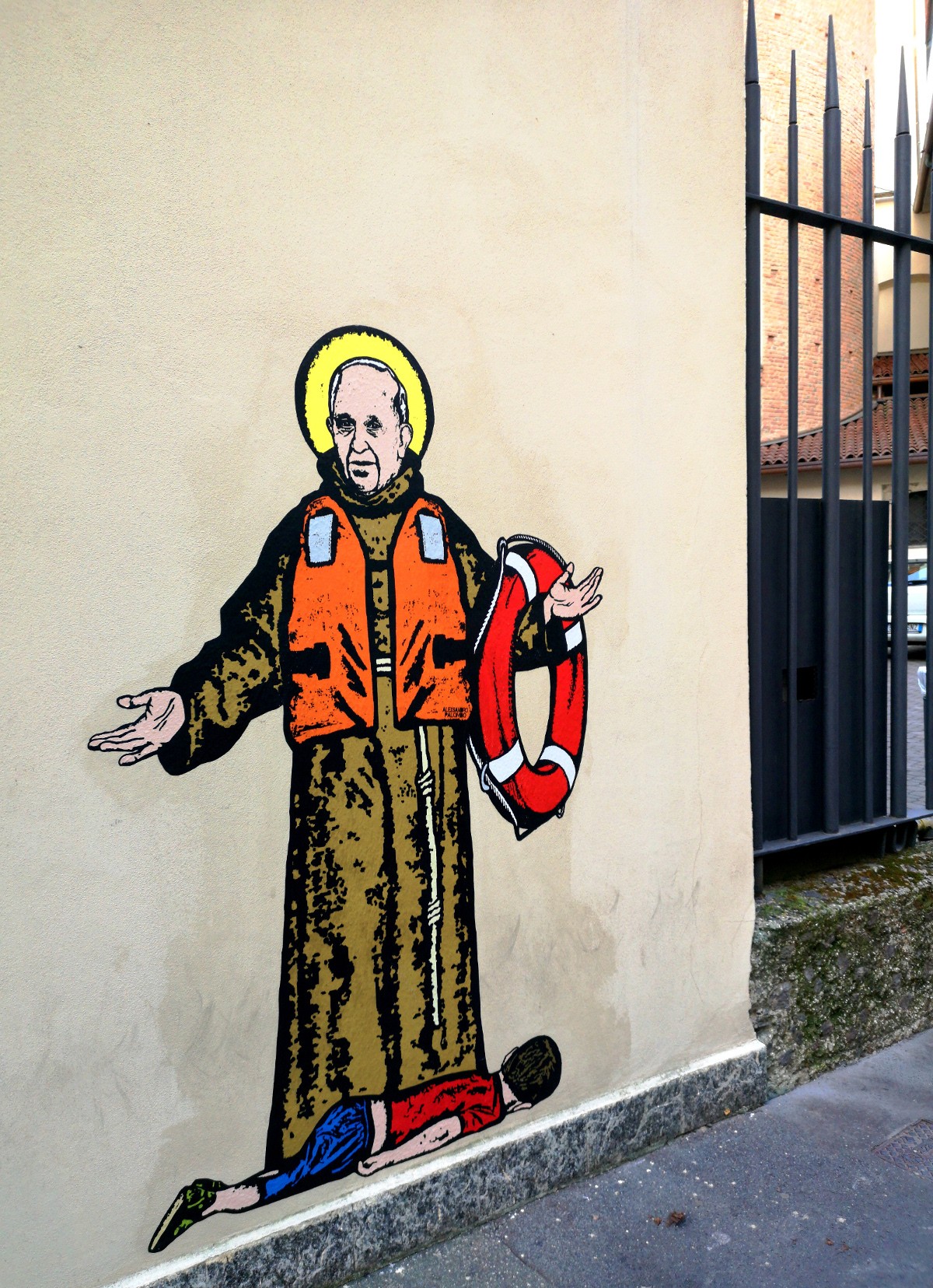 in milan mural of pope francis with drowned migrant boy