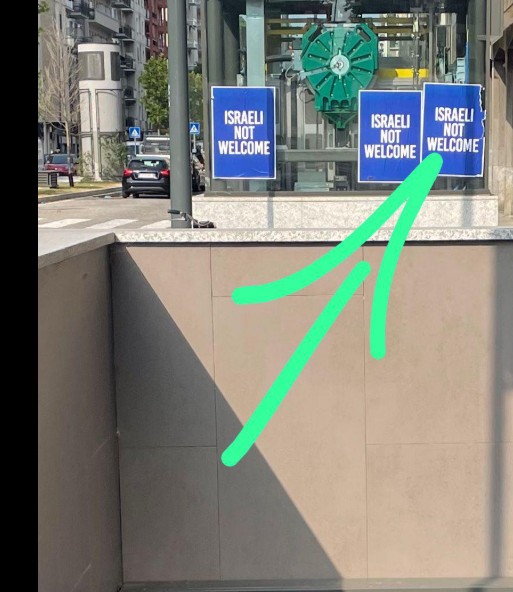 in milan signs in english say israelis not welcome