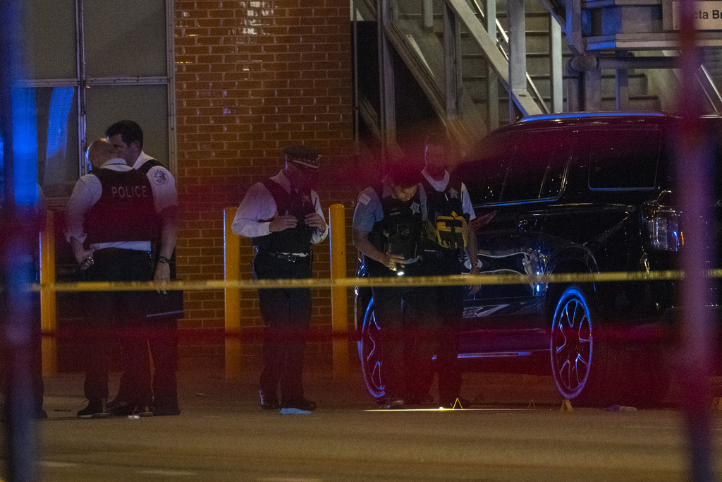shots fired from moving car in chicago 4 dead and 14 injured