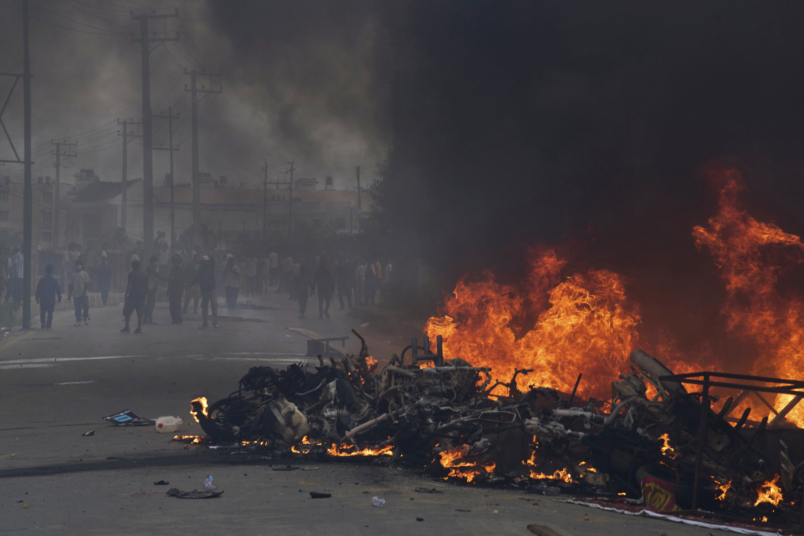 nepal protesters set fire to parliament building scaled