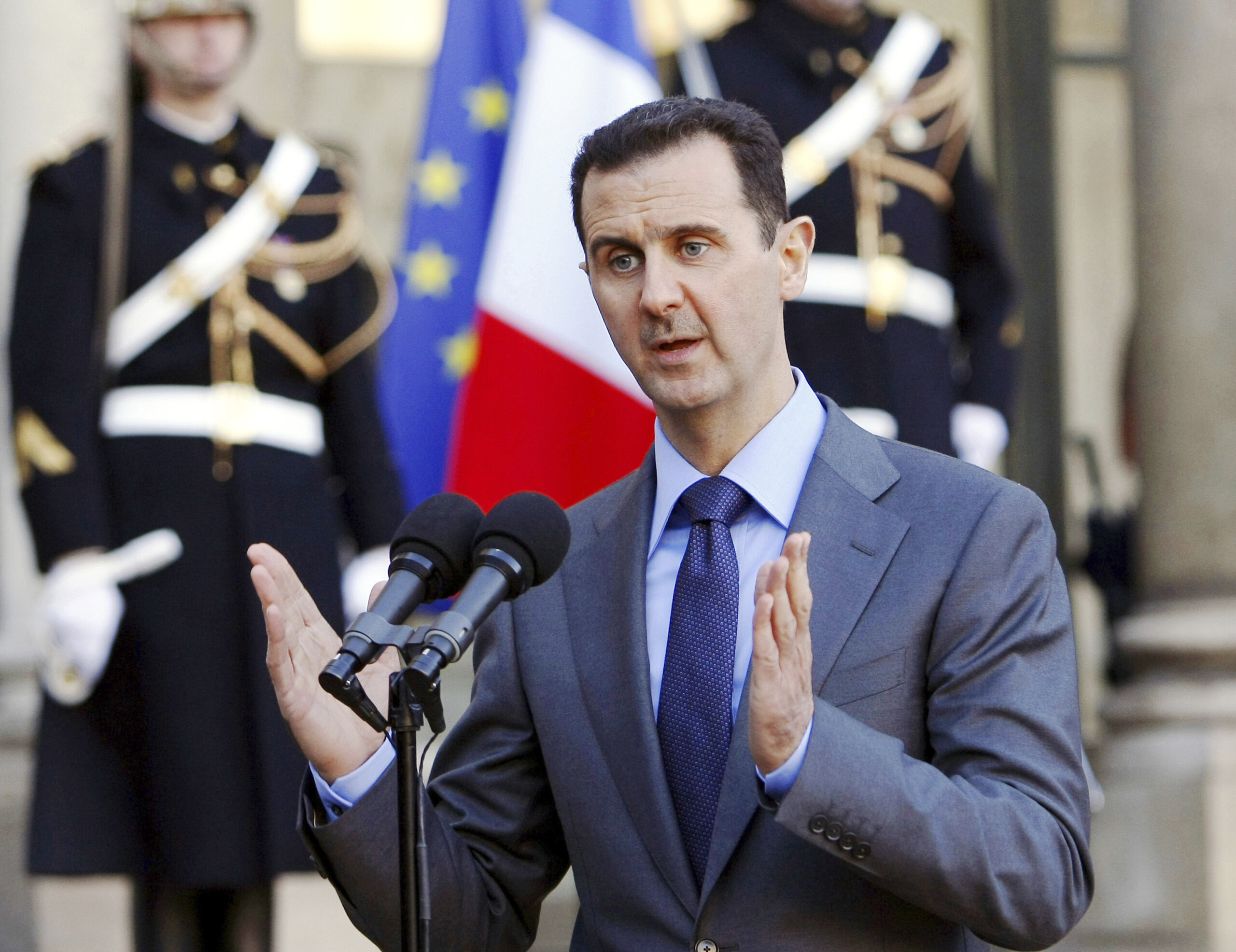 syria arrest warrant issued for former president assad scaled