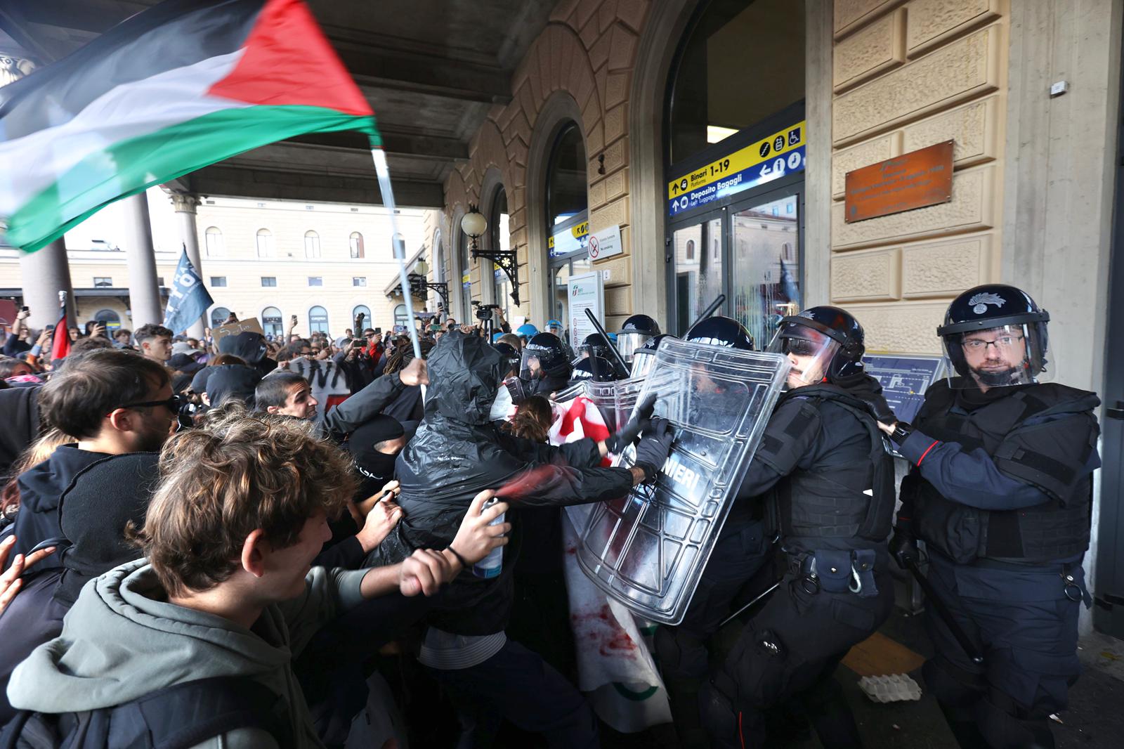 flotilla clashes between protesters and police at bologna station eggs and smoke bombs thrown at law enforcement officers