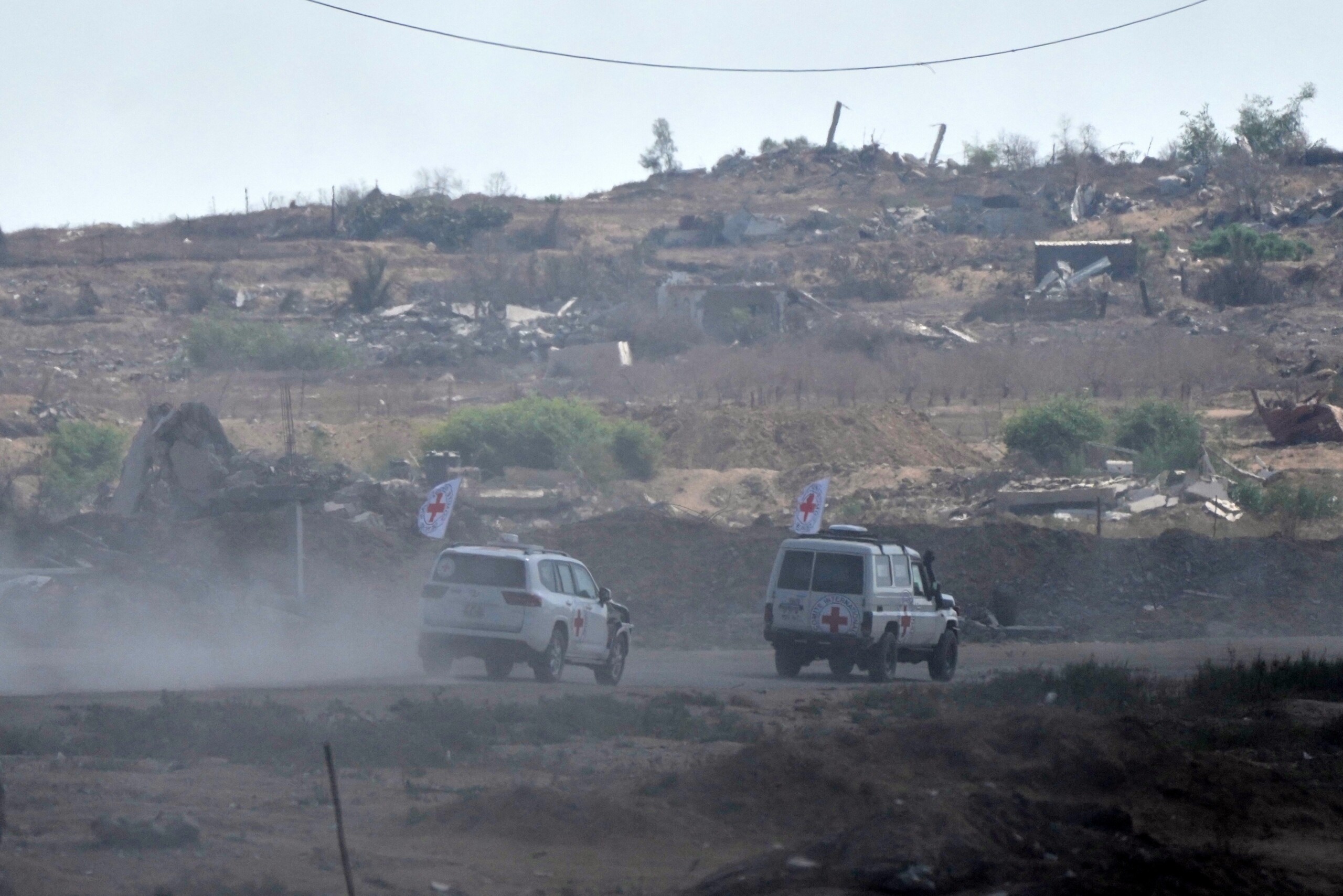 gaza idf red cross vehicles on their way to receive hostages bodies scaled
